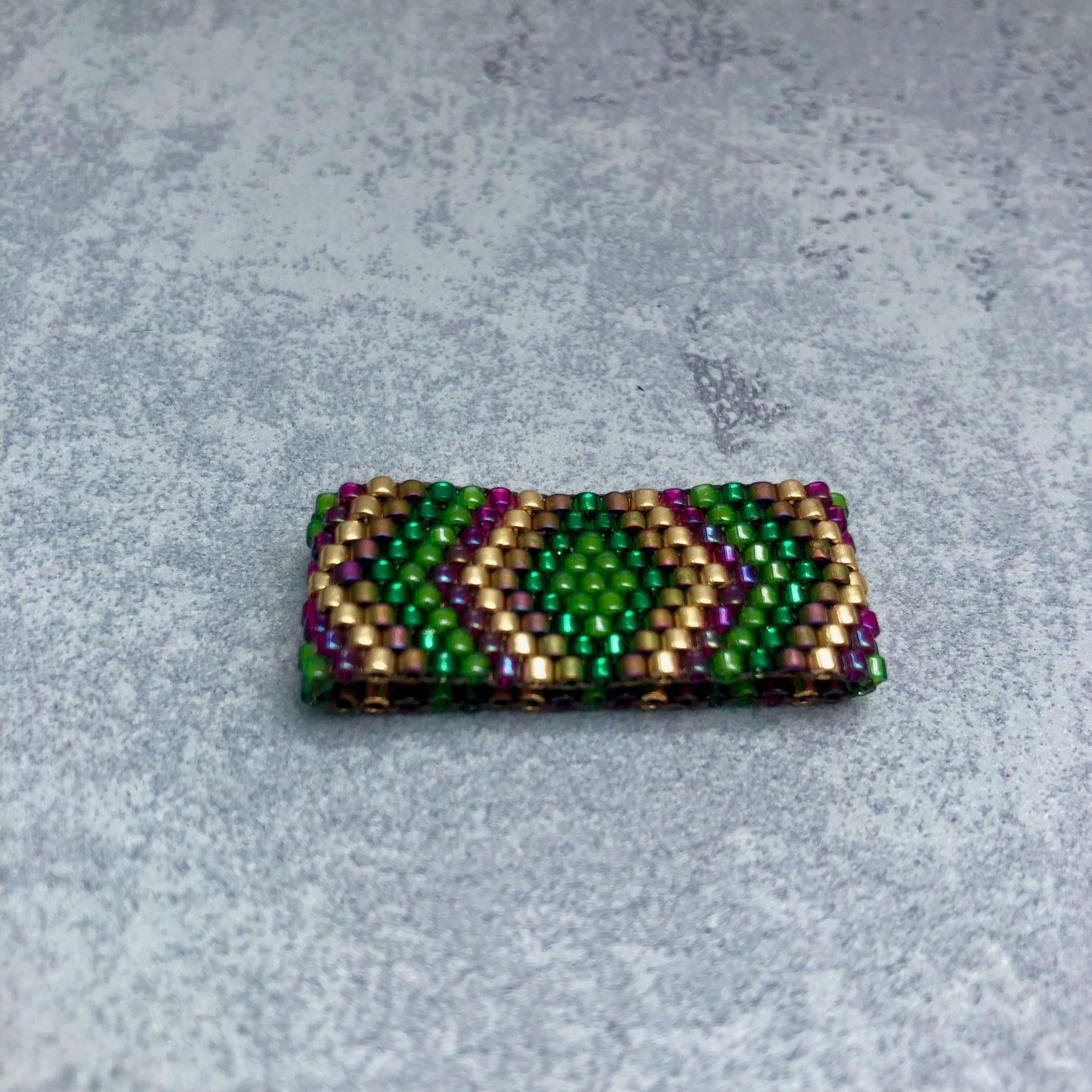 Ring in Gold/Violett/Grün